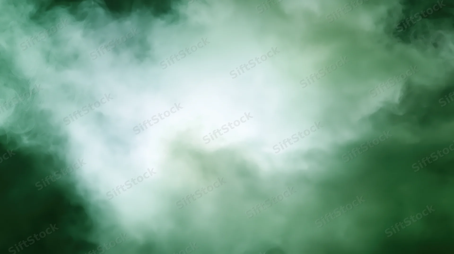 Swirling green smoke forming a soft abstract cloud with central brightness and diffuse edges