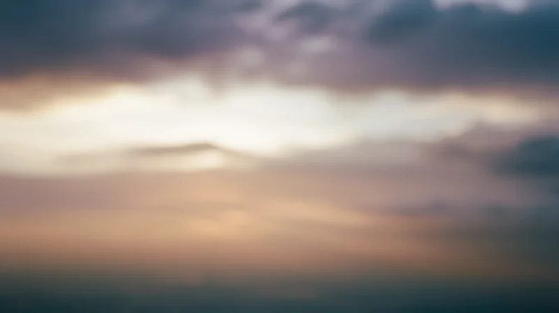 Soft pastel sky with blurred clouds at twilight horizon