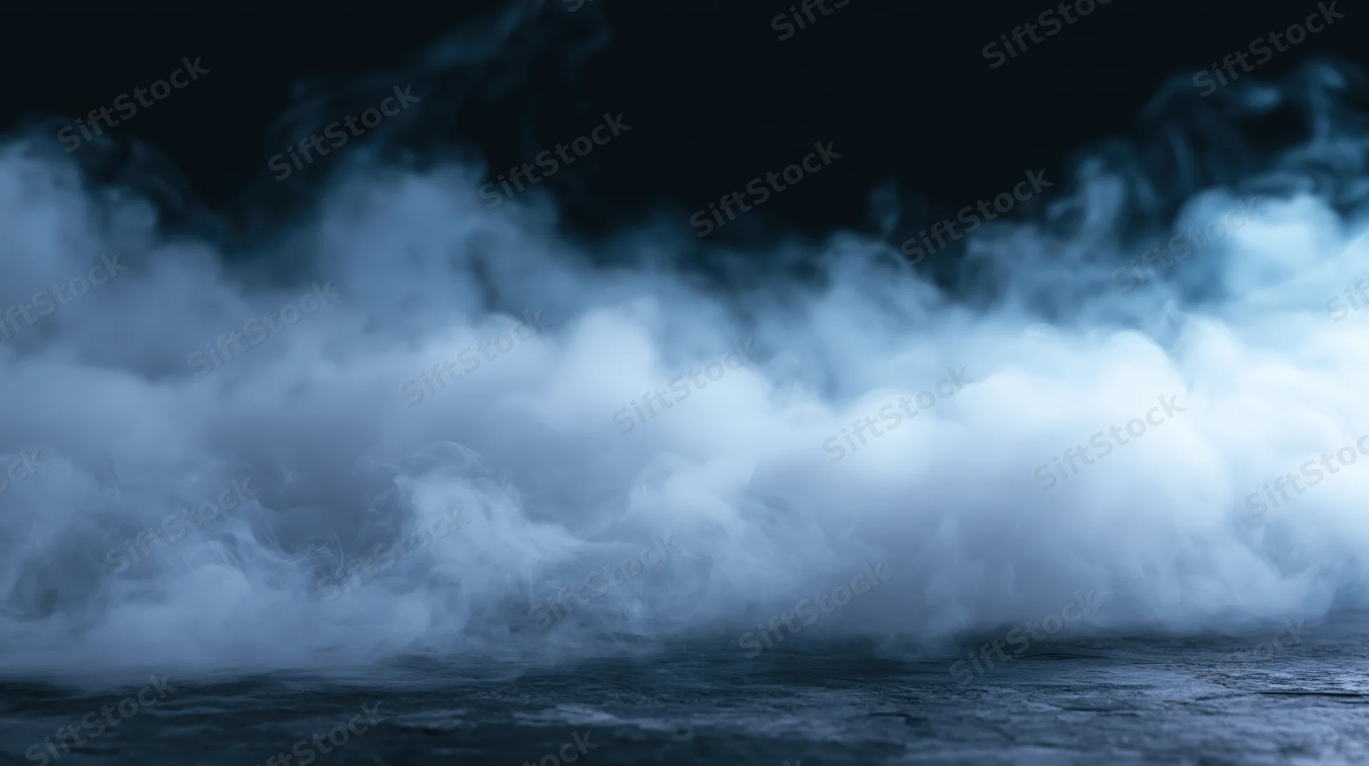 Swirling smoke rising from dark ground at night