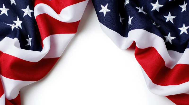 American flag draped on white surface with central copyspace