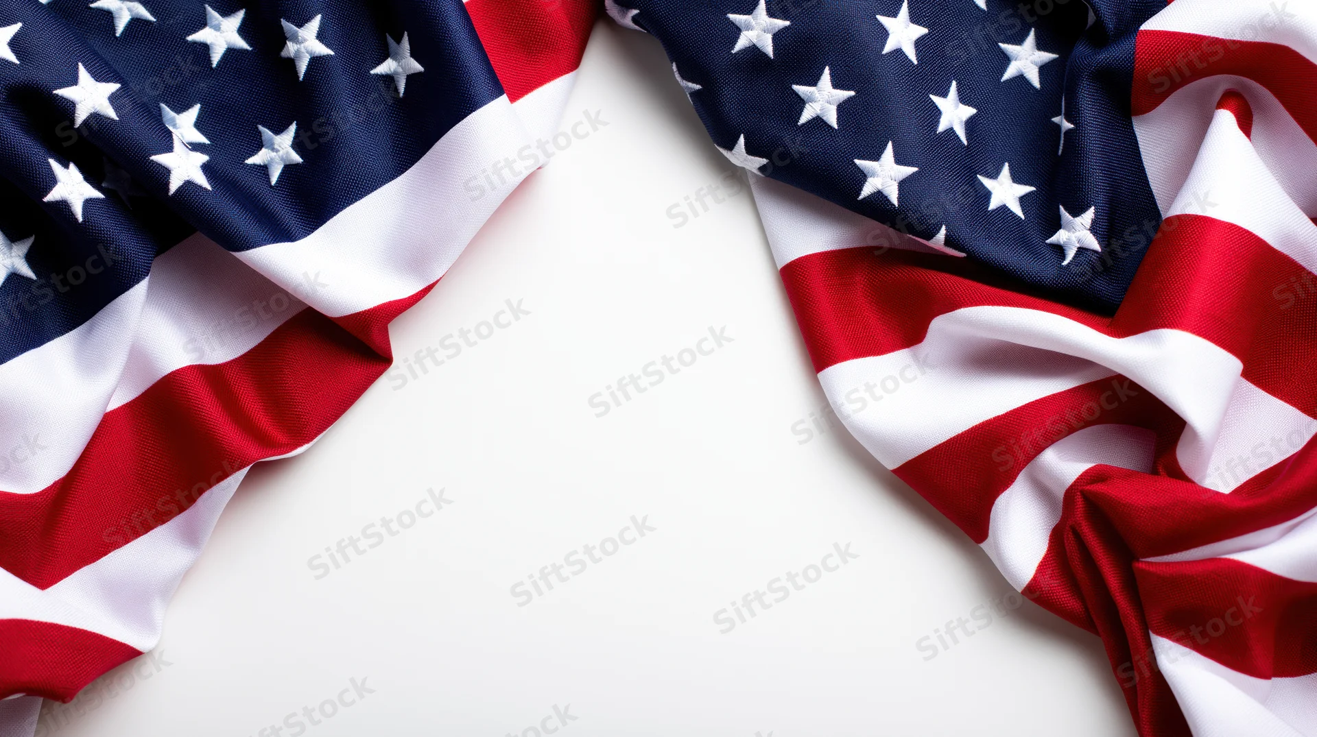 American flag draped in corners on white background with copyspace