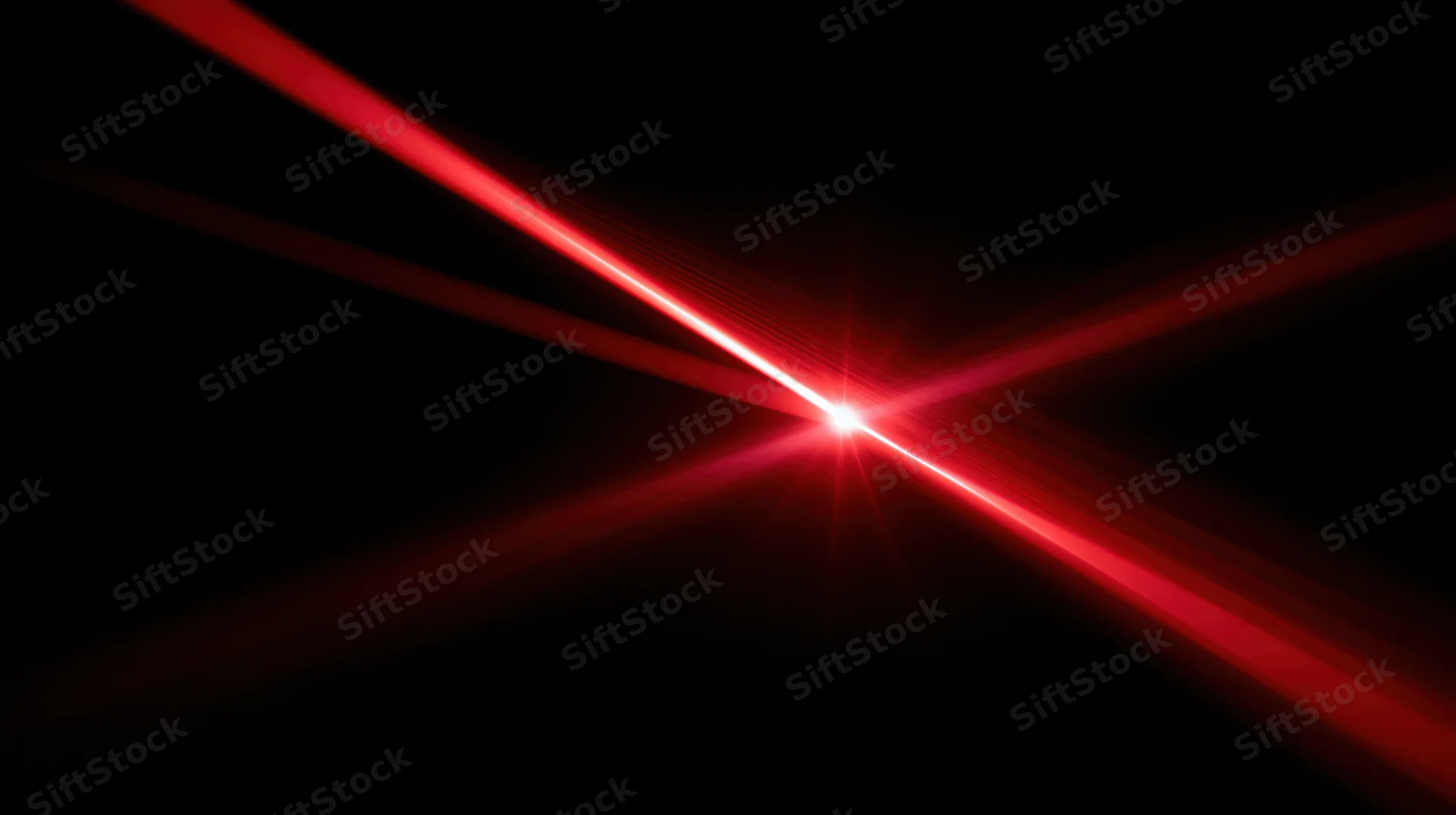 Red laser beams converging at center against black background