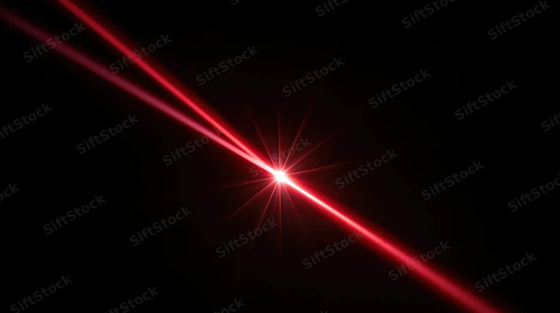 Red laser beams converging to a bright starburst point on a black background