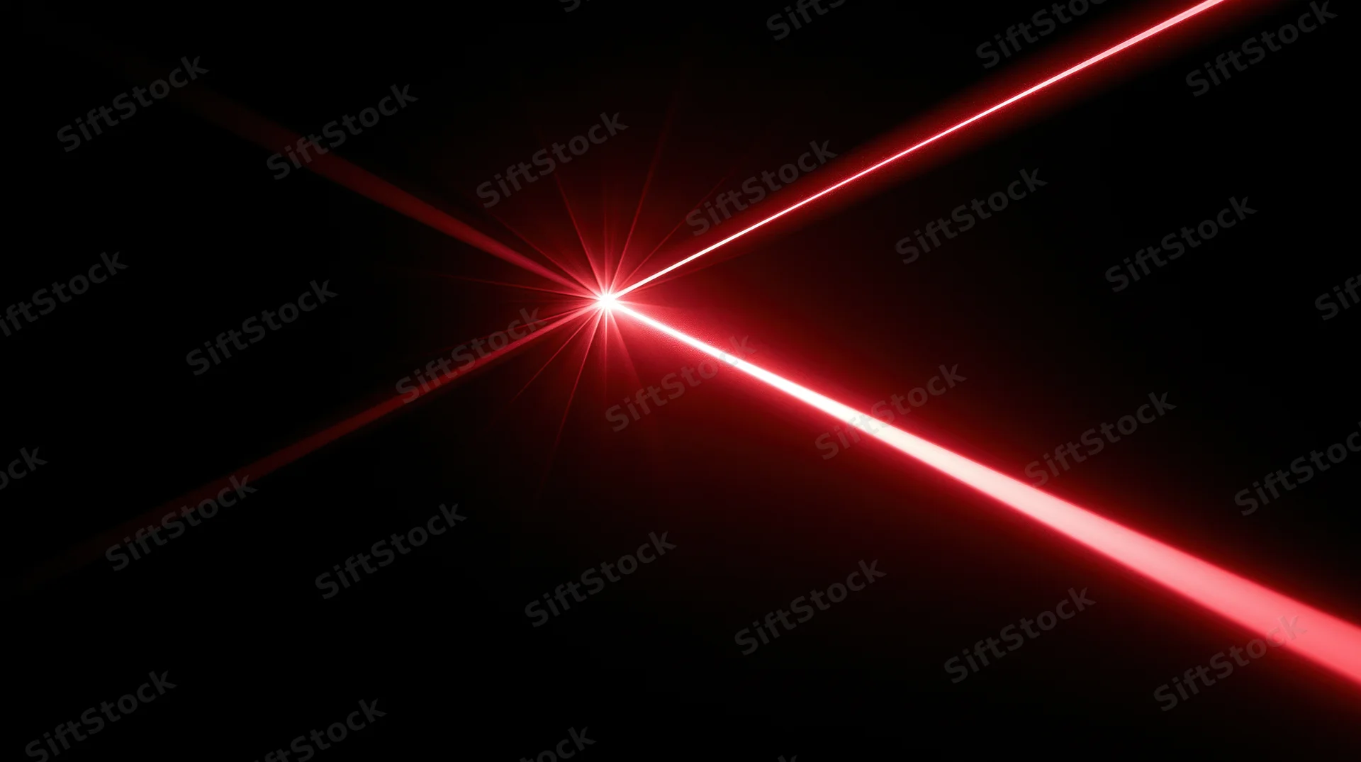Red laser beams intersecting in dark space with bright starburst glow