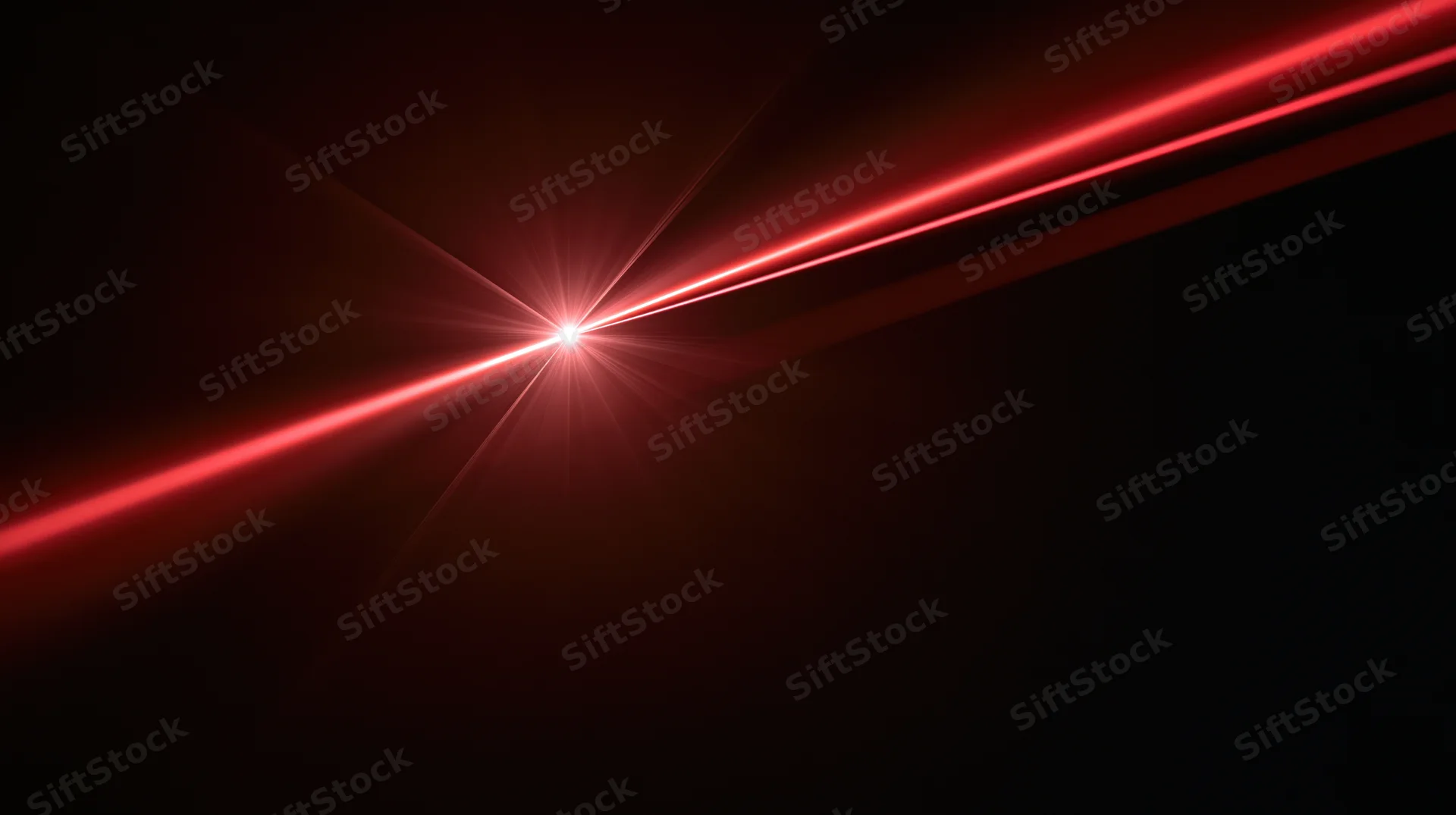 Red laser beams converging to a bright focal point in dark space