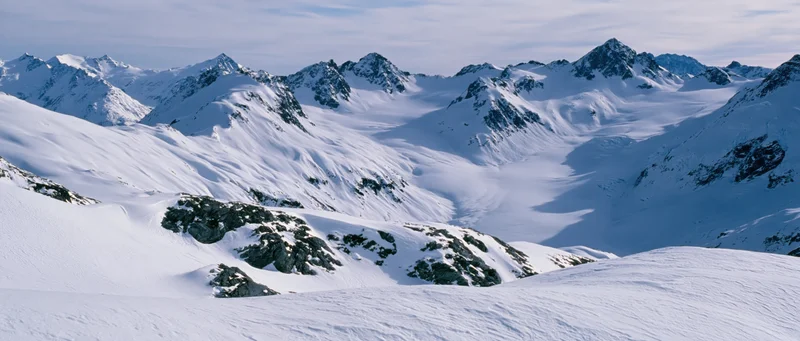 Snow-covered mountain peaks and glaciers in alpine terrain
