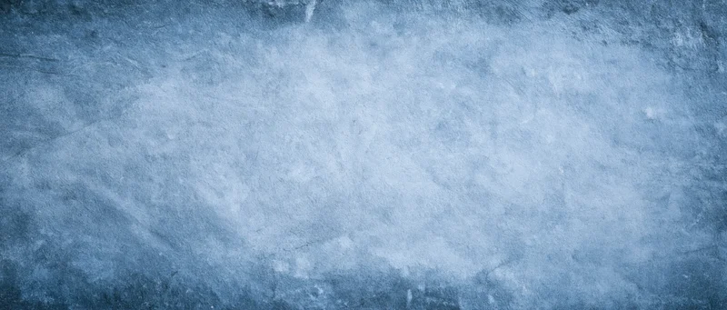 Textured blue-gray concrete surface with frosty weathered appearance