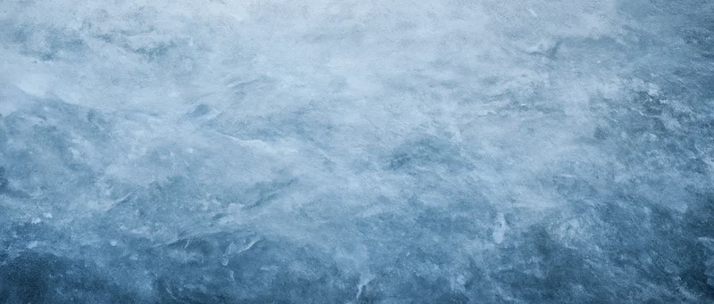 Icy blue textured surface with frost and subtle ripples, resembling frozen water or glacier ice