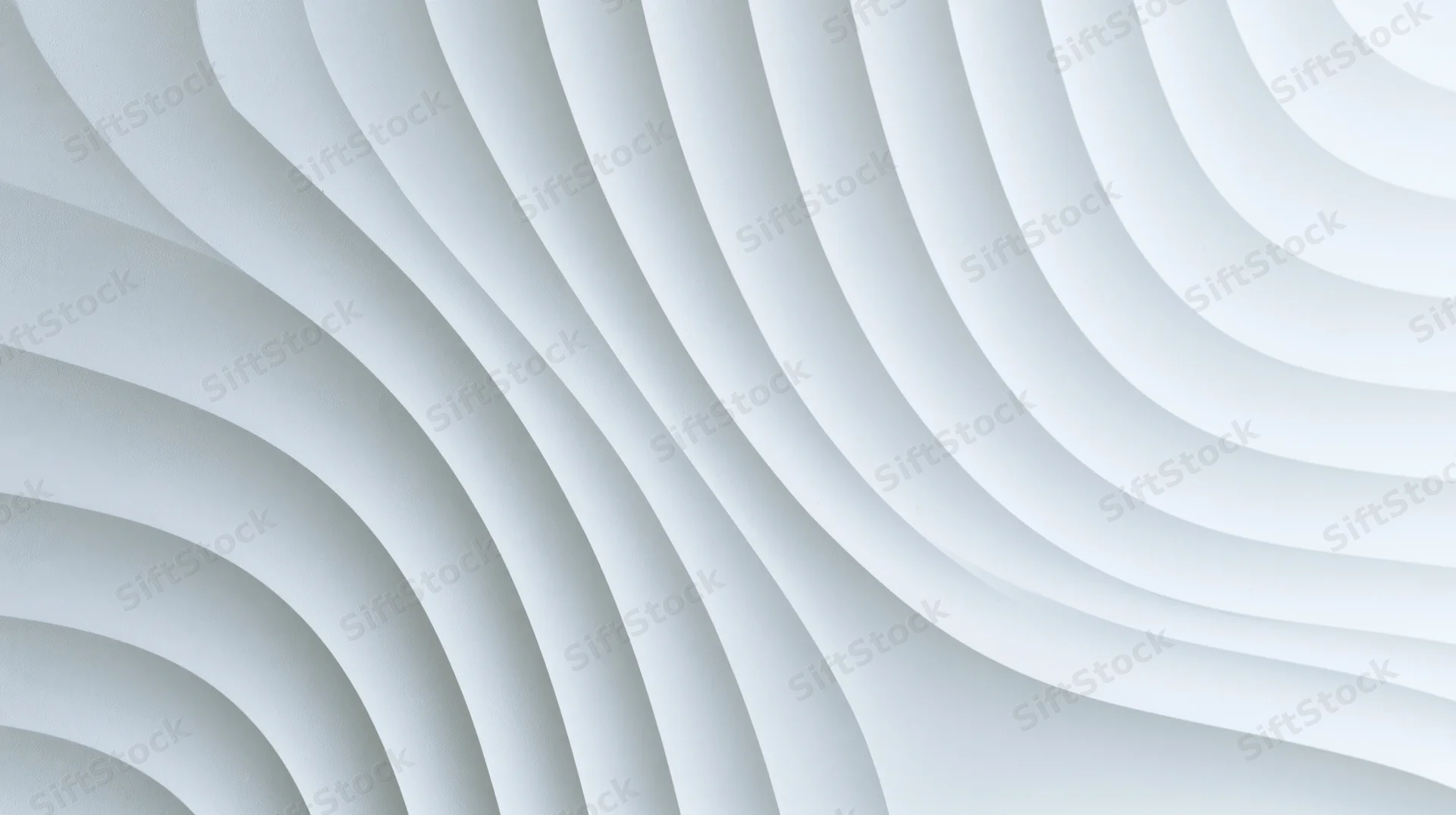 White wavy curved panels arranged in layered geometric pattern on interior wall