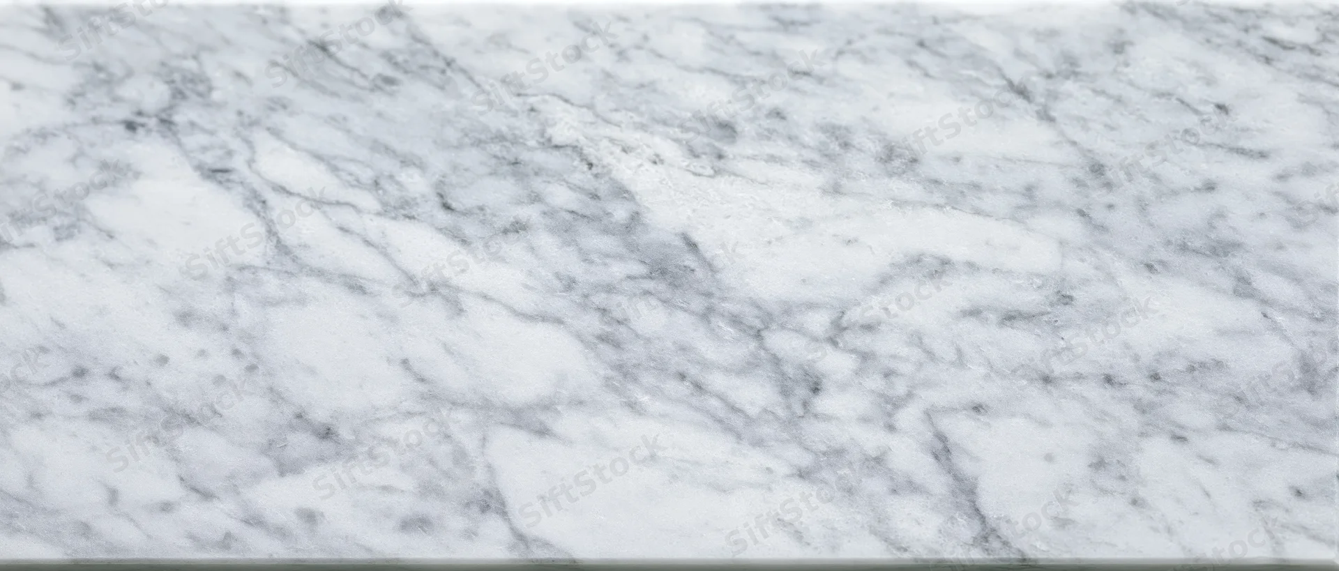 Close-up of white marble surface with gray veining for interior design