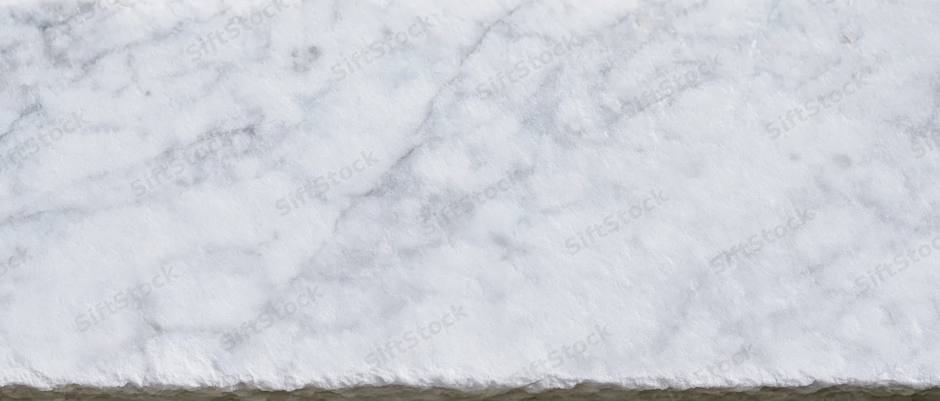 White veined marble slab with polished surface and natural stone texture for interior design