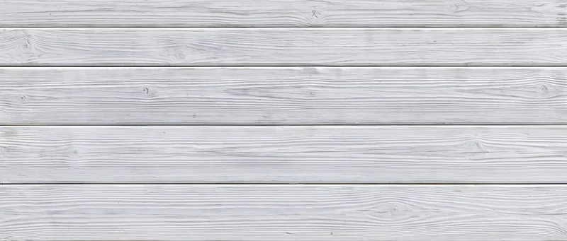 Horizontal white wooden planks arranged in a seamless pattern as a textured background