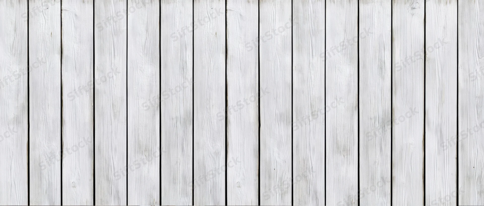 Vertical white weathered wooden planks arranged as a textured background surface