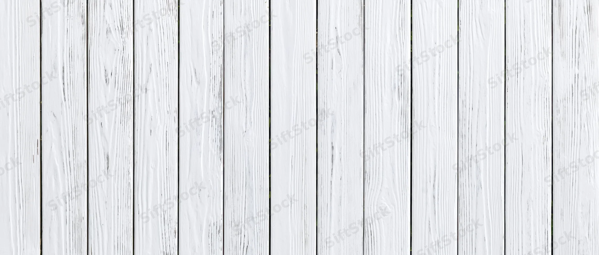 White painted wooden planks arranged vertically as a textured background