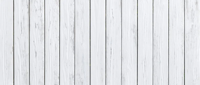 White painted wooden planks arranged vertically as a textured background