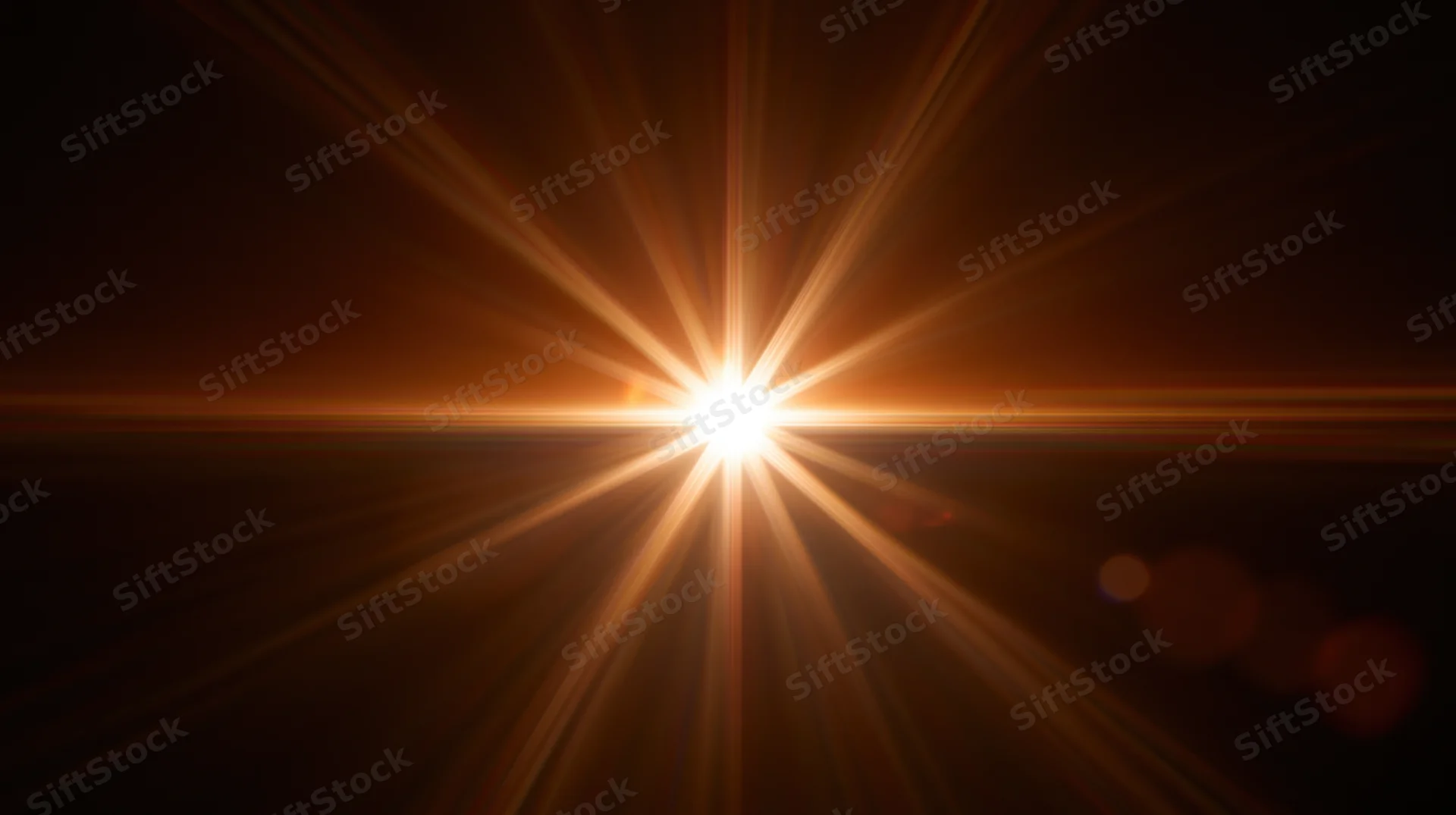 Bright light source emitting radiant beams across dark background with lens flare and bokeh effects
