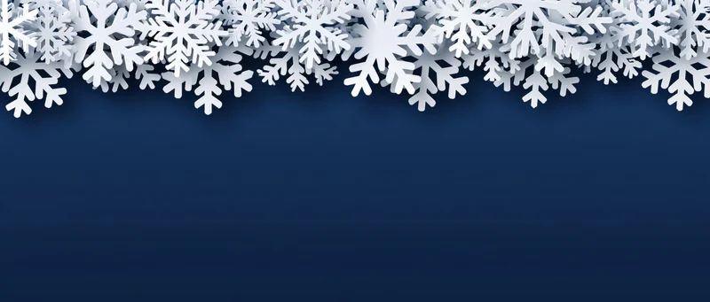 White snowflake border arranged along the top edge of a dark blue background with copyspace below