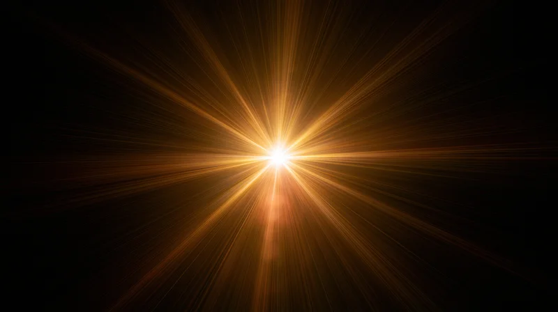 Radiant golden light burst centered in dark space with glowing rays extending outward