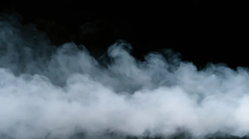 Swirling white smoke billowing across a dark background with soft edges and depth