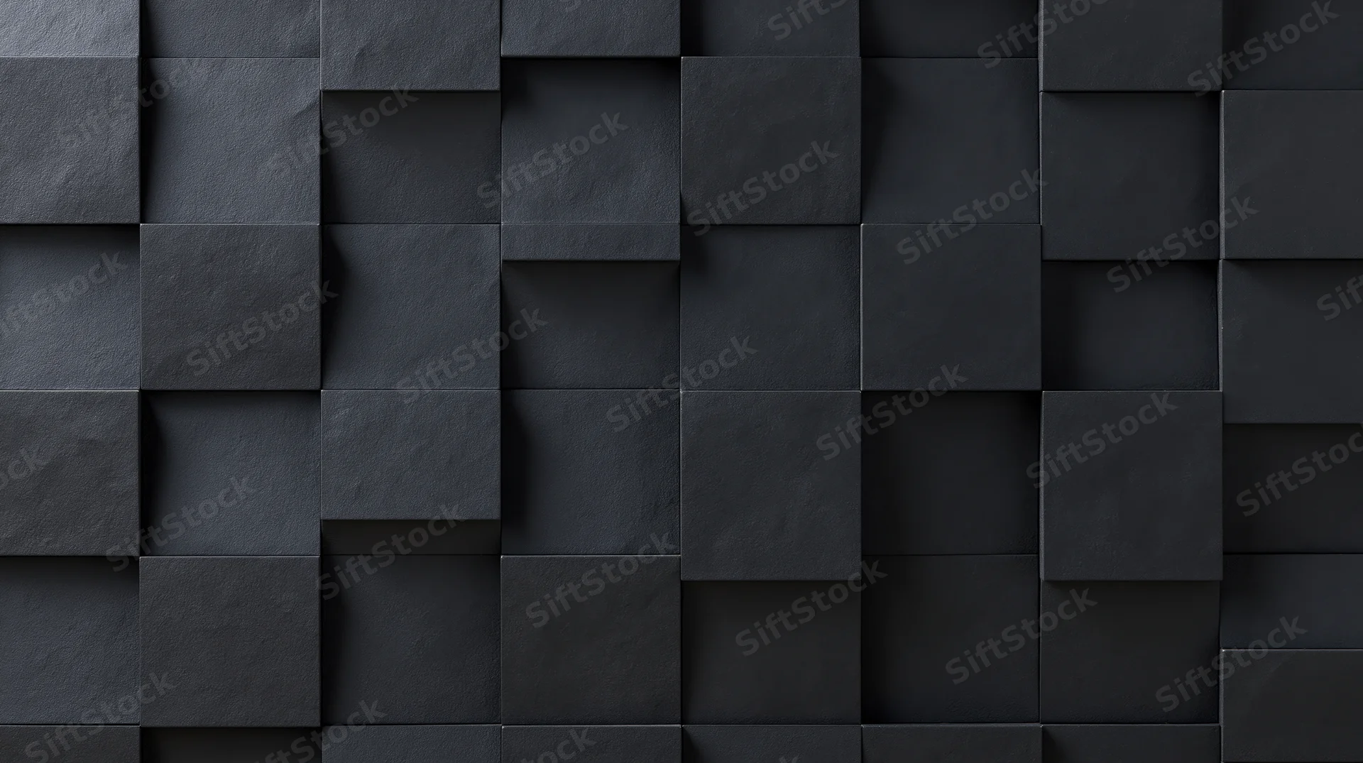 Black geometric cubes arranged in a 3d relief pattern on a wall surface