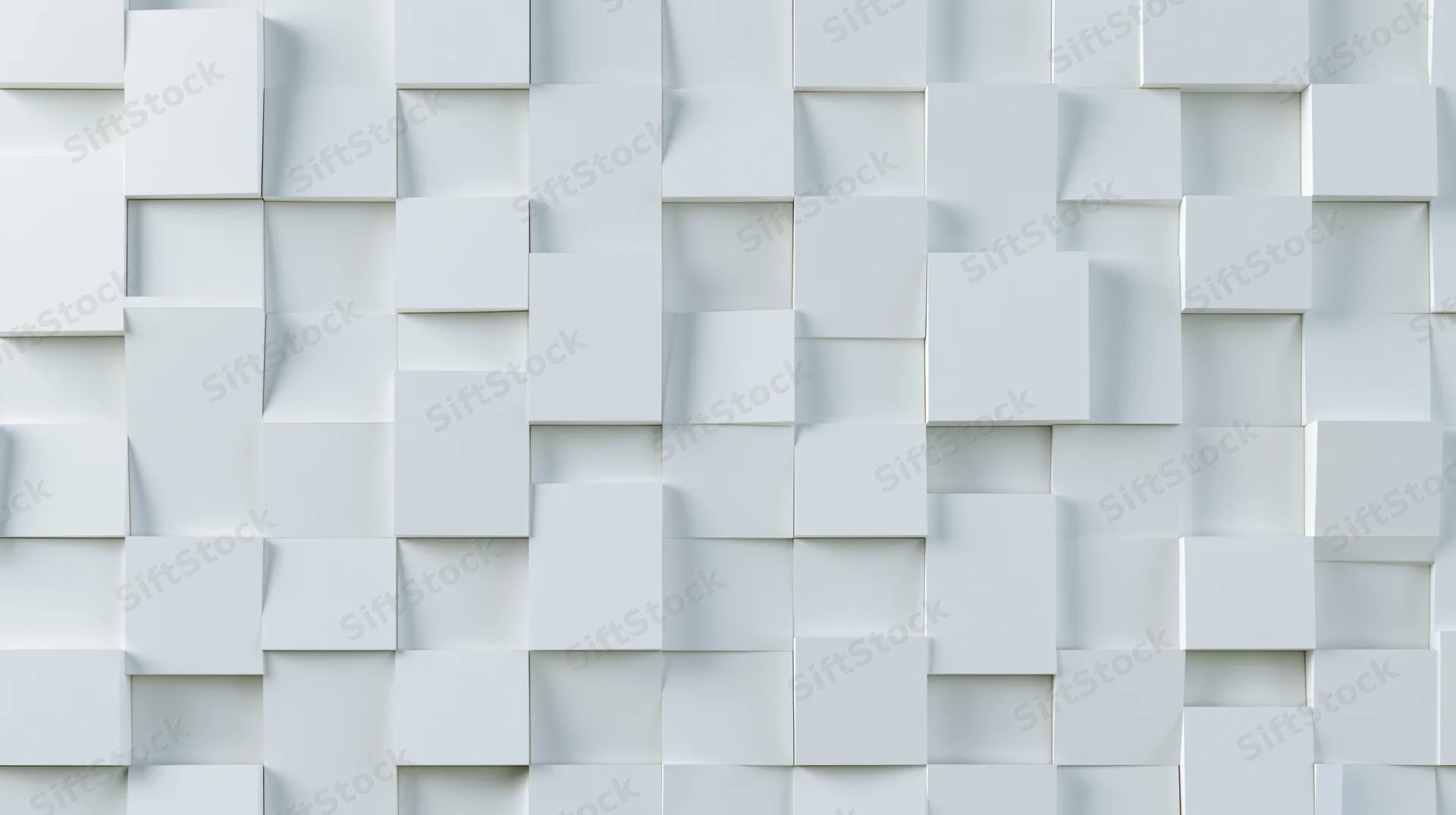 White cubes arranged in a three-dimensional geometric pattern on a wall surface