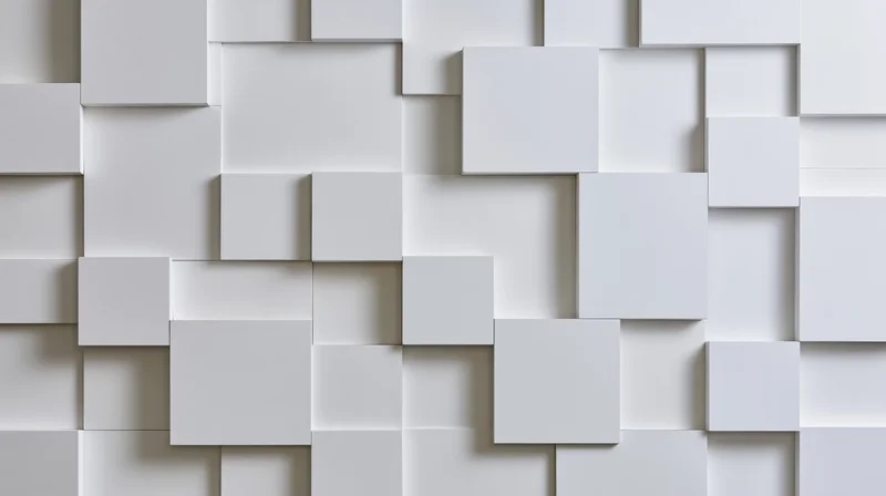 White geometric cubes arranged in a 3d pattern on a wall surface