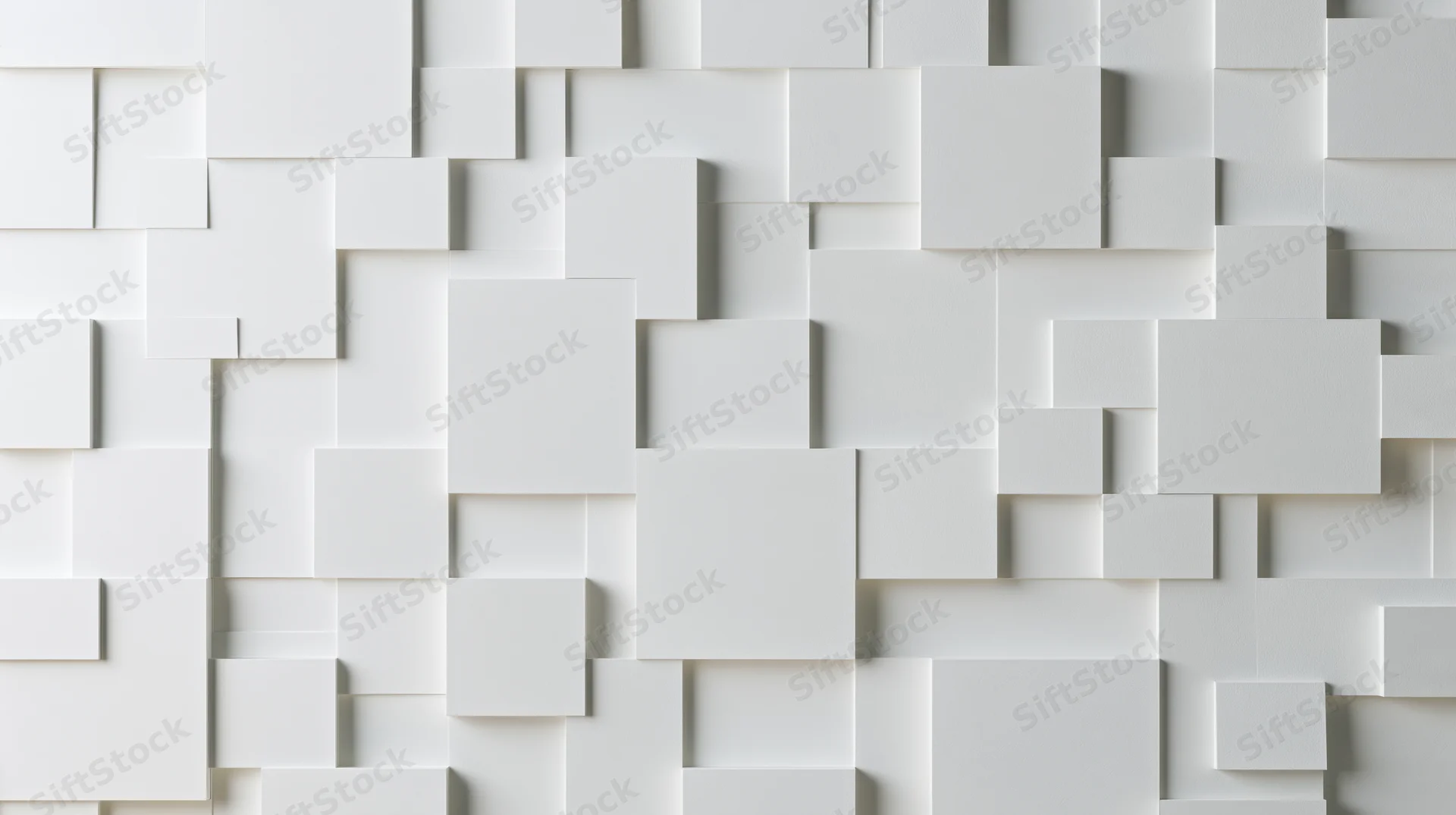 White geometric cubes arranged in a modular pattern on a wall surface
