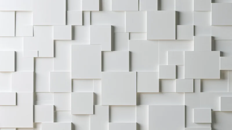 White geometric cubes arranged in a modular pattern on a wall surface