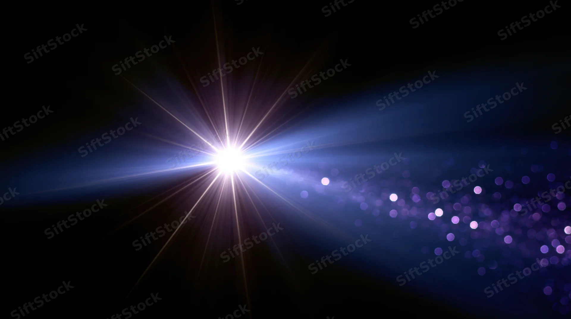 Bright starburst light radiating across dark background with purple bokeh particles