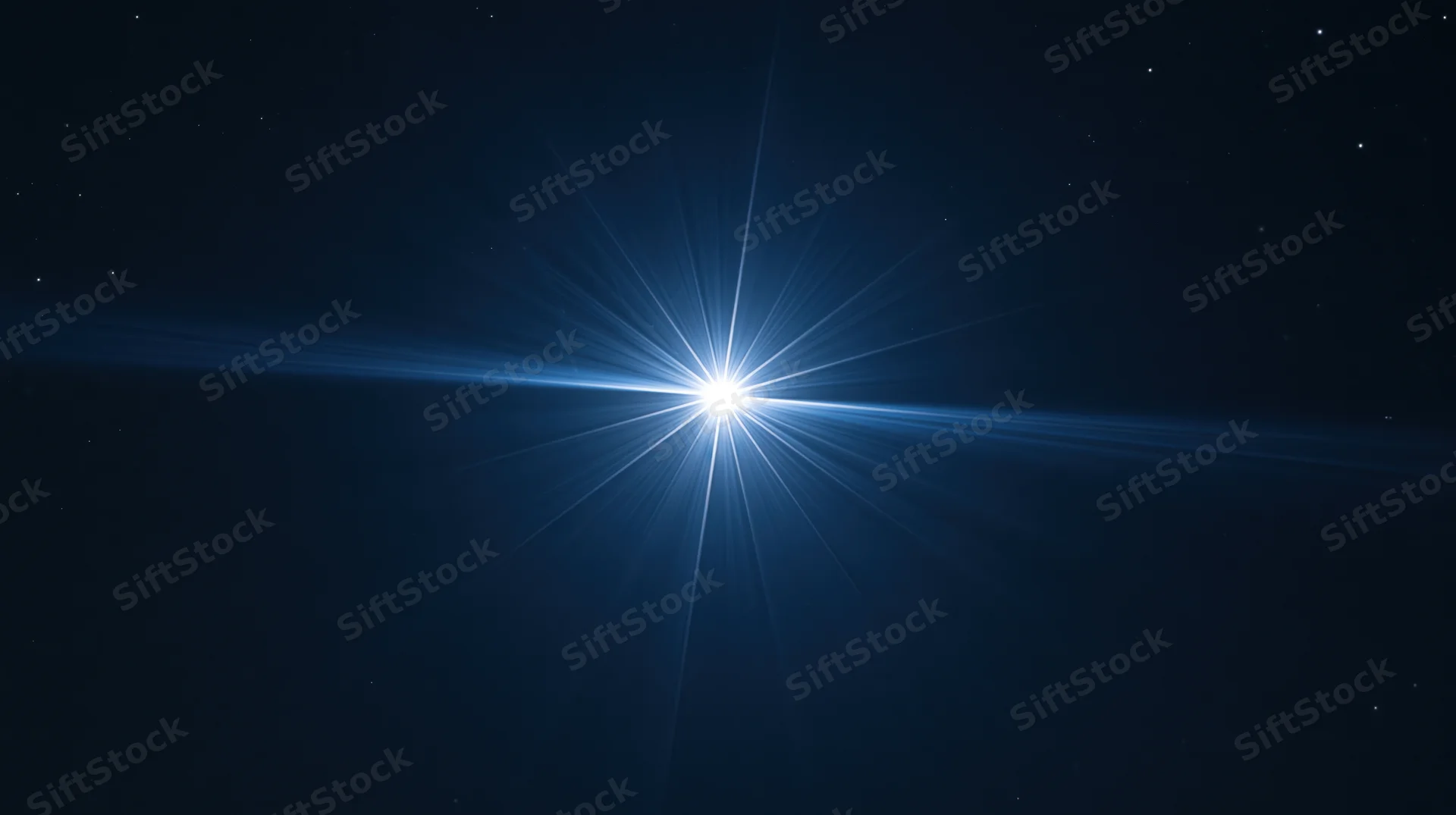 Bright star radiating light beams across dark night sky