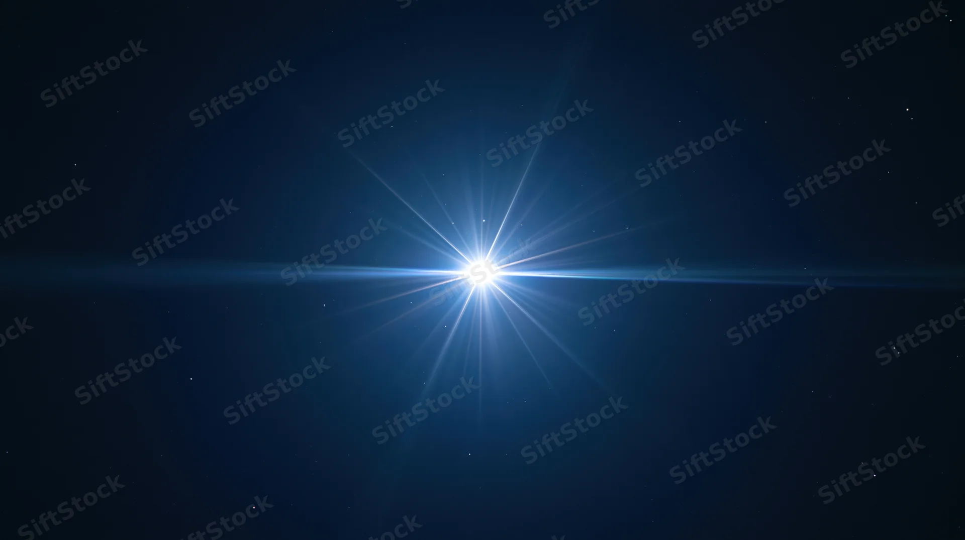 Bright star shining in dark night sky with lens flare and scattered stars