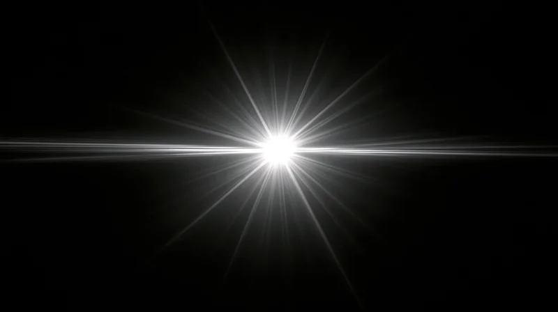 Bright white light burst radiating from center against black background with horizontal flare and symmetrical rays