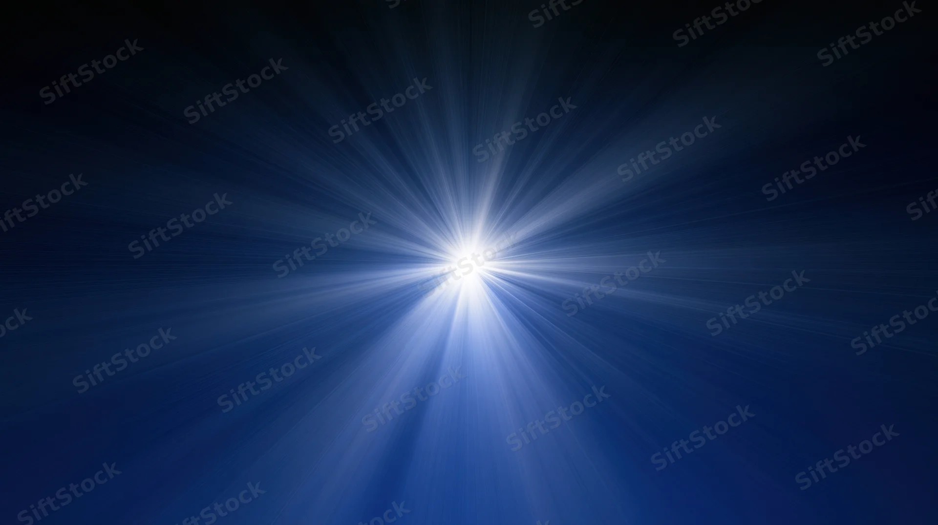 Bright white light burst radiating from center against dark blue background