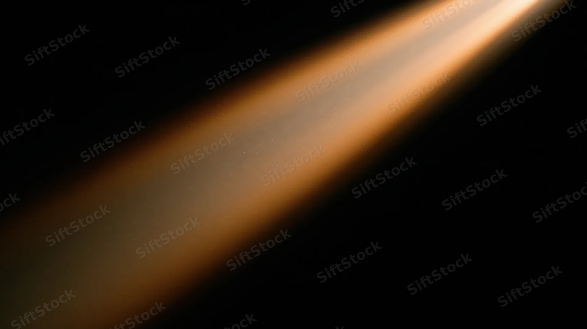 Diagonal beam of warm orange light across dark background with soft glow and gradient intensity