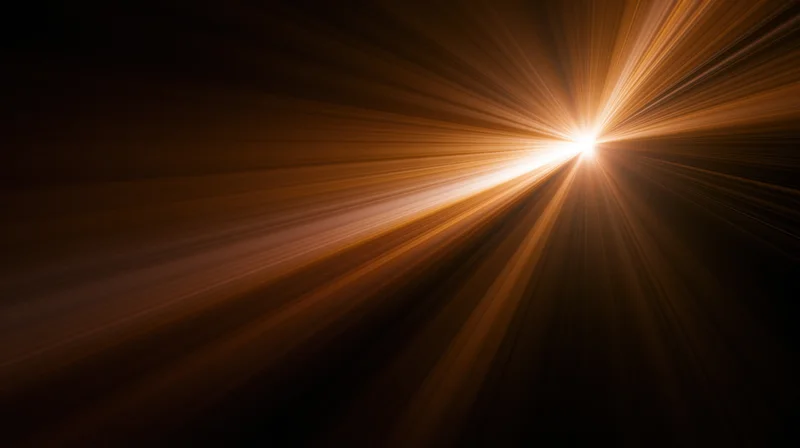 Radiant light burst emanating from a central point in dark space