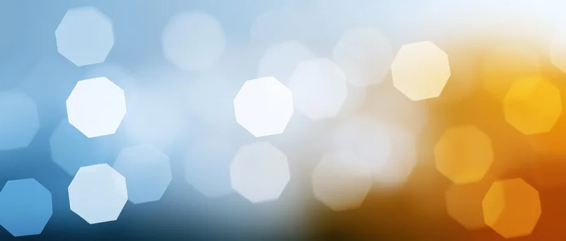 Abstract bokeh lights in blue and orange gradient with soft focus and octagonal shapes