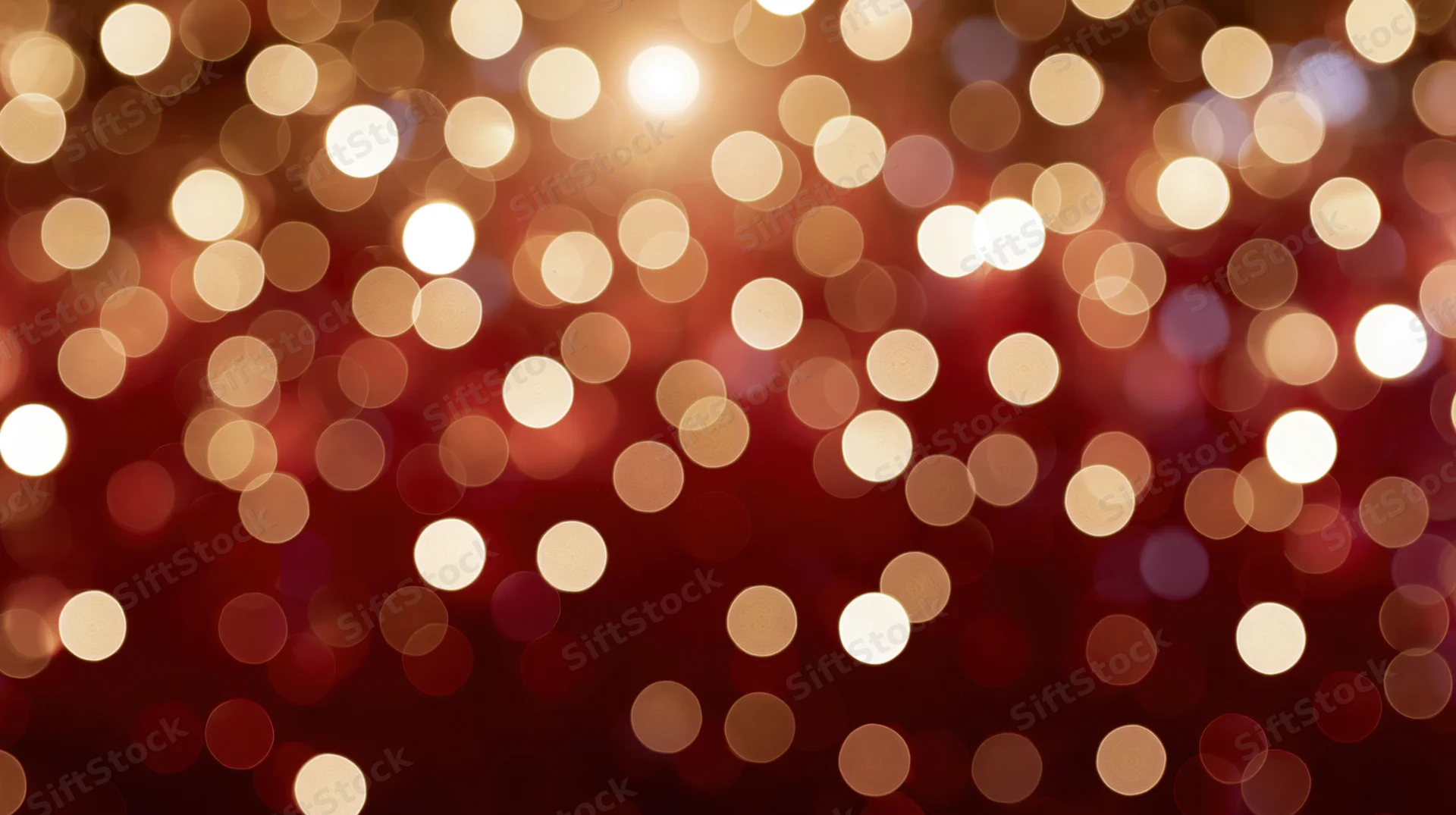 Blurred golden lights in circular bokeh pattern on red background for festive holiday decoration