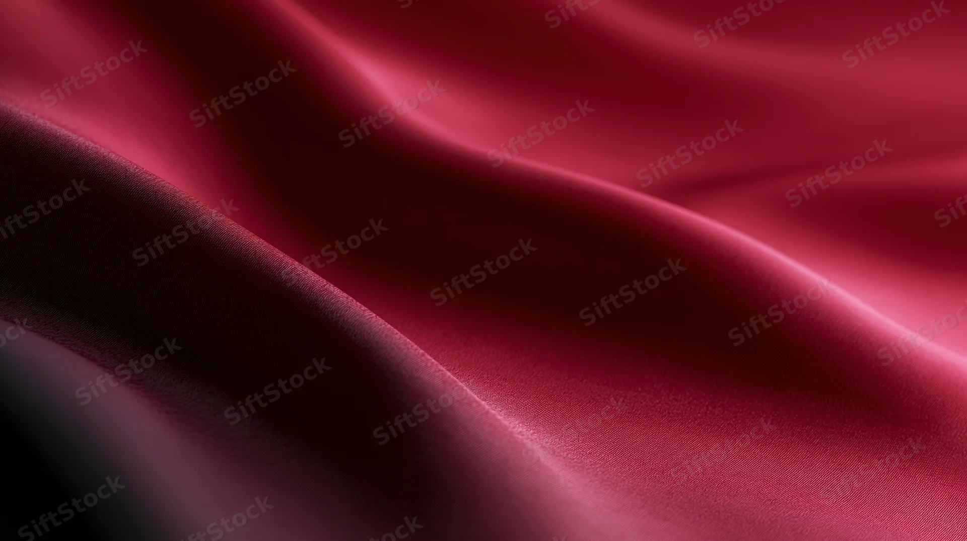 Flowing red silk fabric draped in soft folds with lustrous sheen