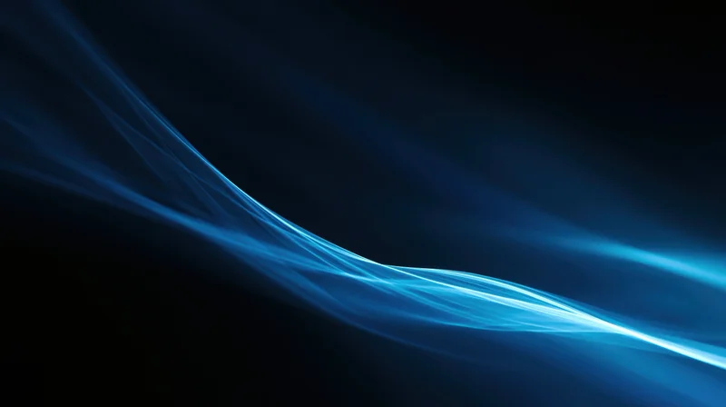 Glowing blue light waves flowing across a dark background