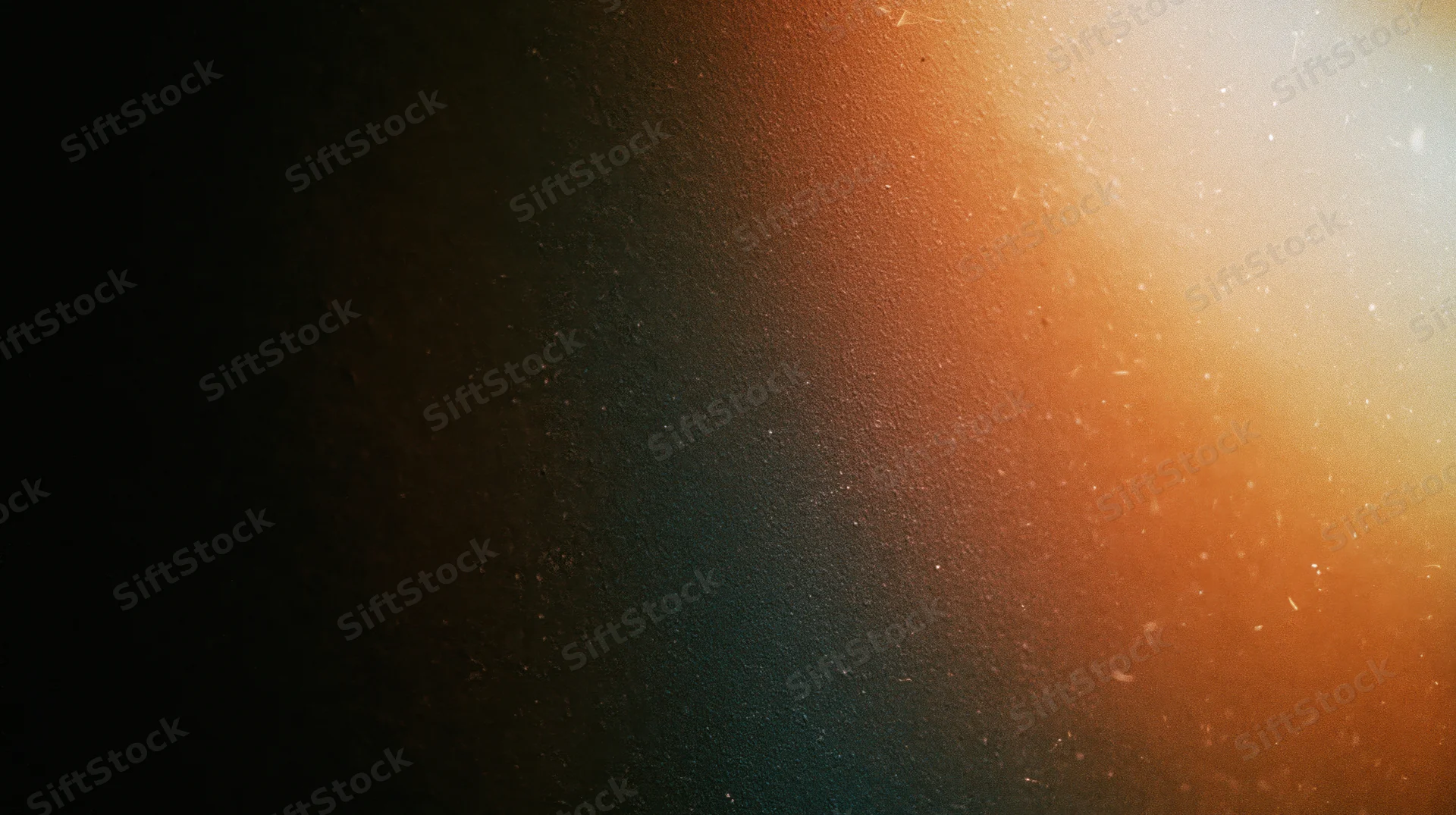 Warm orange light gradient with soft glow and floating particles on dark textured background