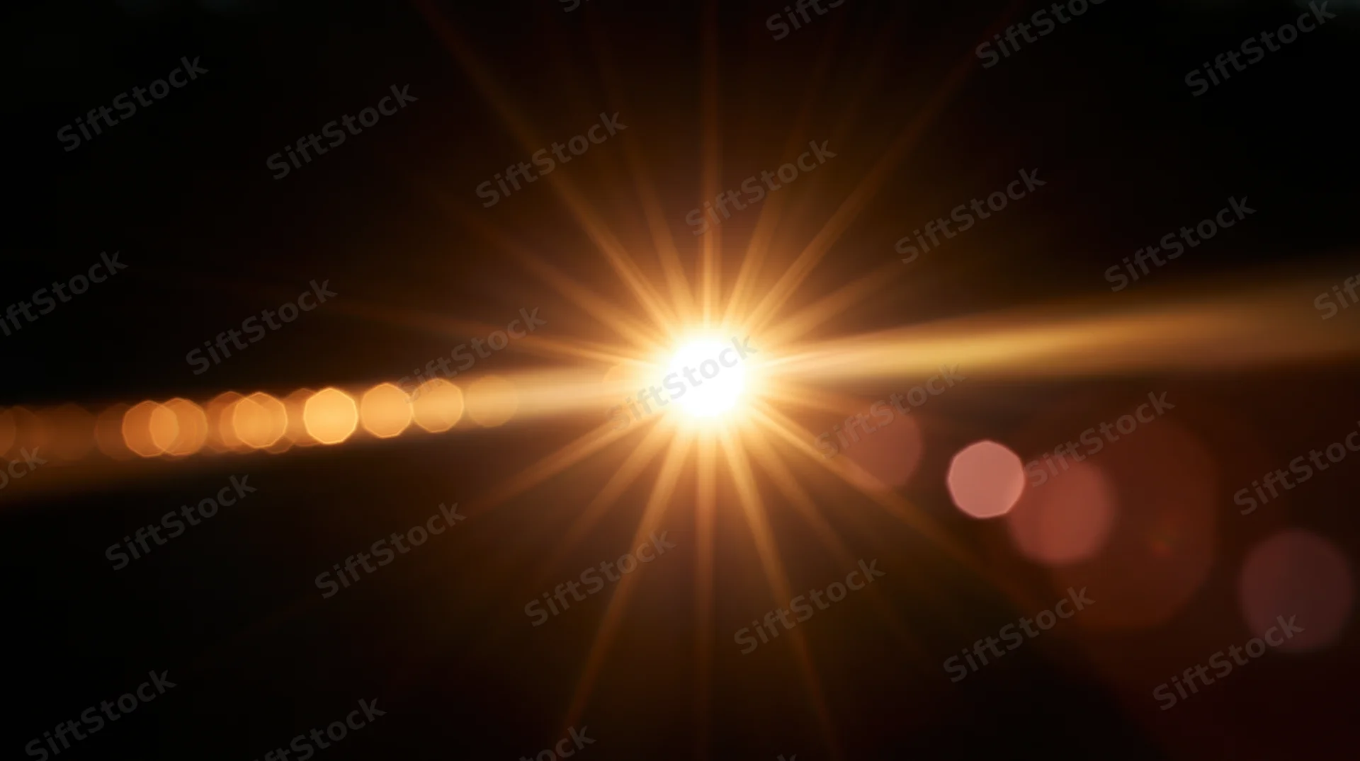 Bright light source with starburst flare and bokeh circles on dark background