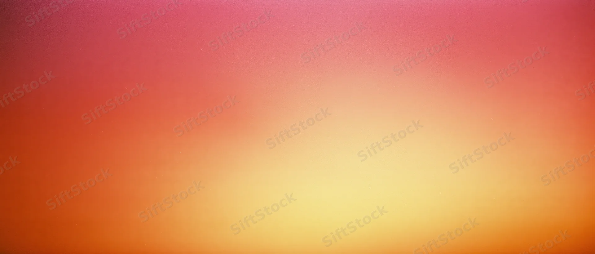 A smooth color gradient transitioning from pink to orange and yellow across the frame