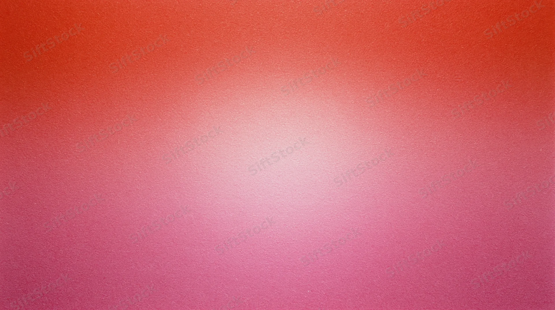 A smooth red to pink color gradient background with soft light transition