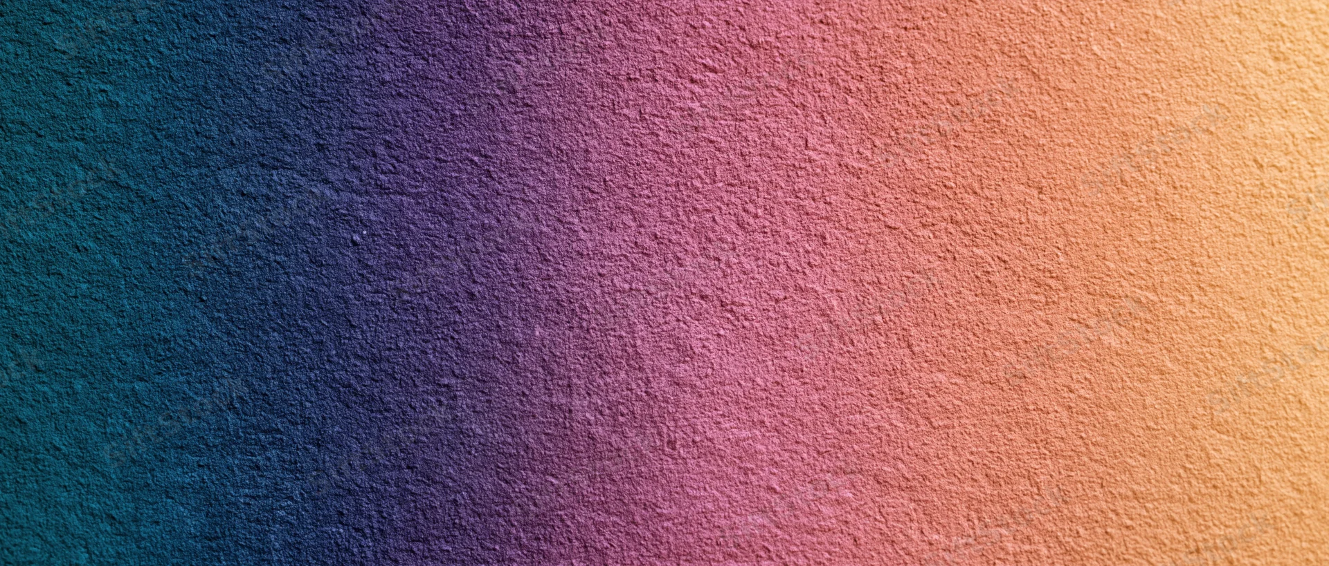 Smooth color gradient transitioning from teal to orange across a textured surface