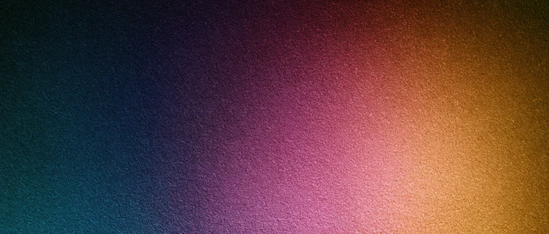 A smooth color gradient transitioning from dark blue to warm orange across a textured digital background