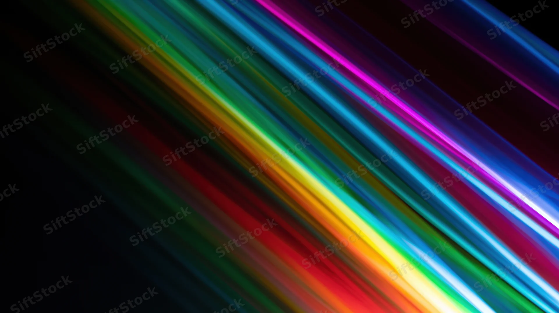 Diagonal streaks of rainbow light across a dark background with copyspace