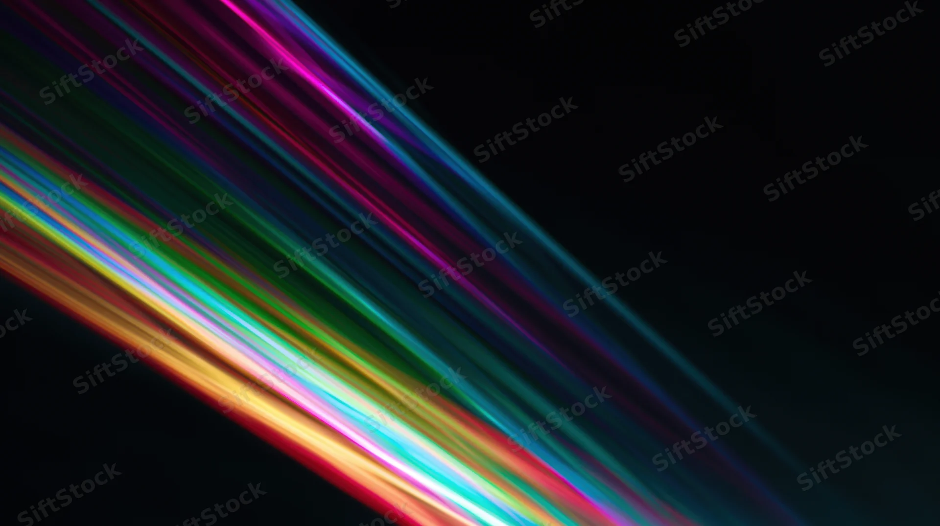 Diagonal streaks of rainbow-colored light across a black background