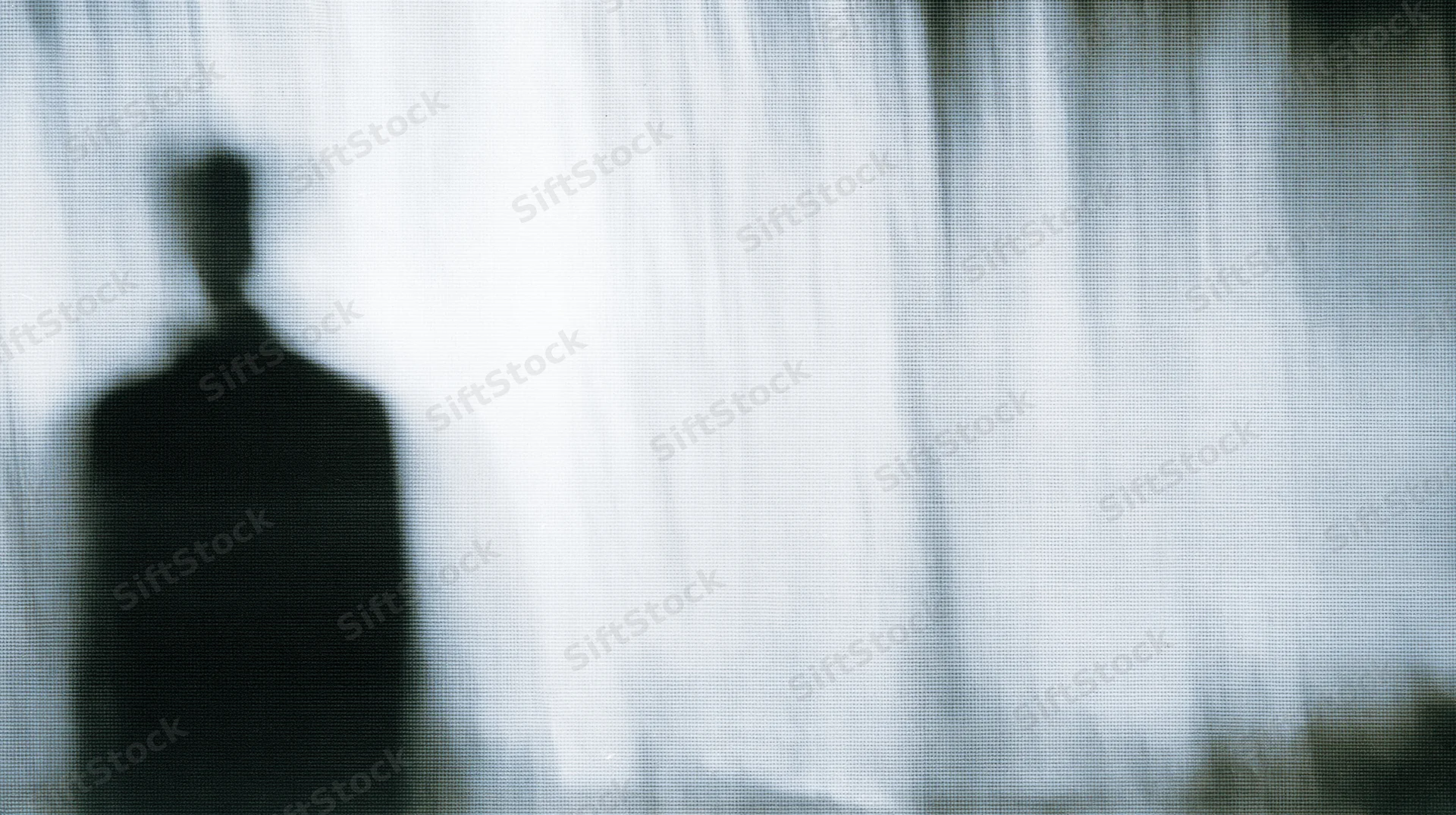 Blurred silhouette of a person standing against a bright, textured background with high contrast and digital noise