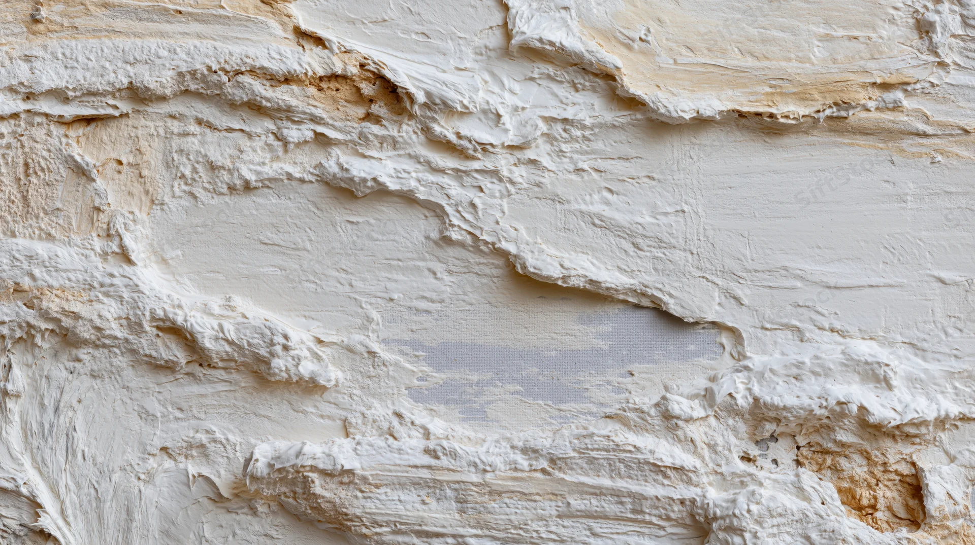 Cracked and peeling white plaster wall showing damage and repair needs