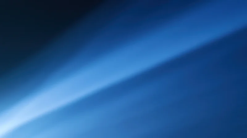 Diagonal blue light gradient across abstract background with soft glow and copyspace